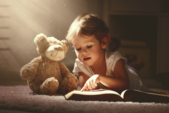 aa019c5be4689fa2af930fa2f659cbfc5edb4a39_child-reading-with-teddy-bear